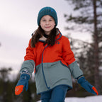 Winter mittens on a child: blue mittens with orange details