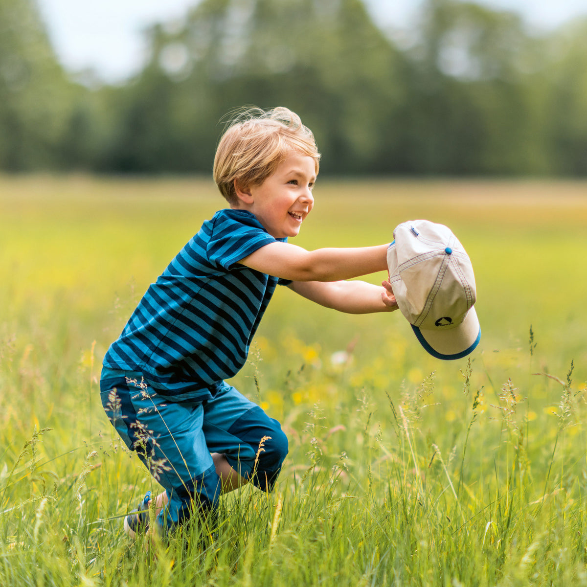 Child wearing a blue striped crew neck t-shirt with short sleeves