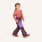 Children's snow pants: purple pants with a blue zipper, side pockets and colorful details