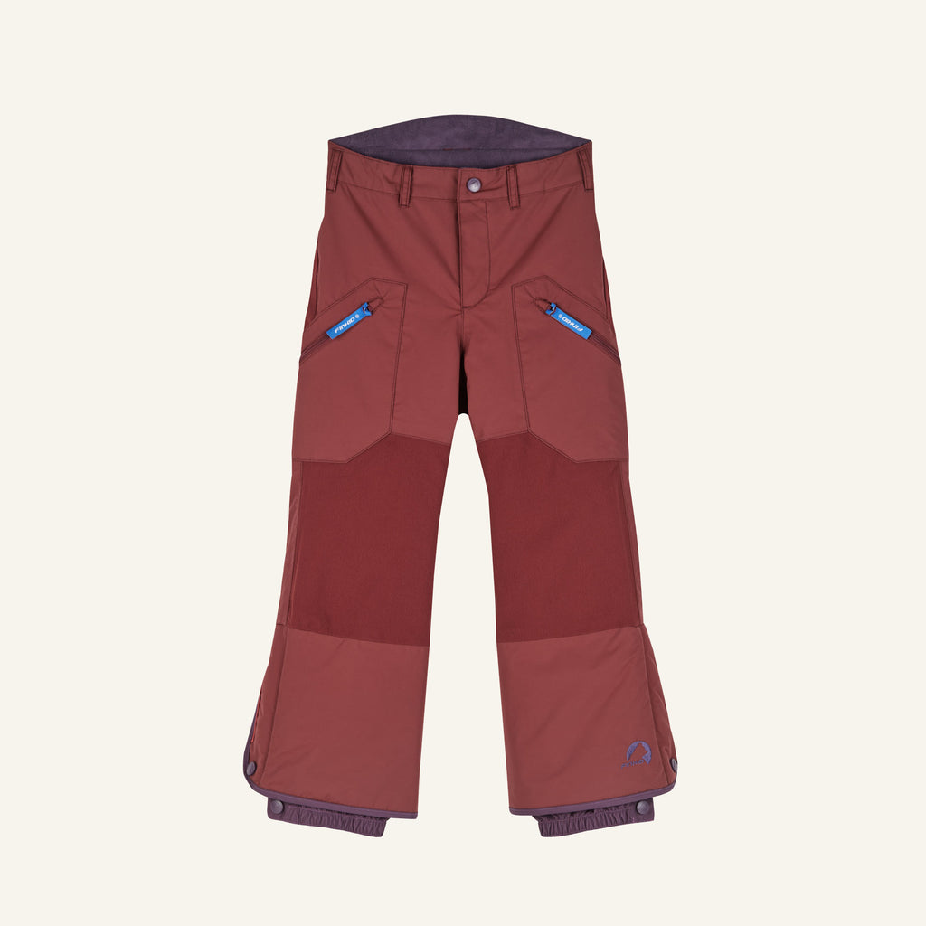 Snow pants in rust red with front button, side zippered pockets, and dark blue hem cuffs