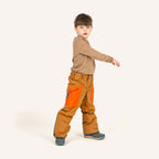 Kids' snow pants in brown-orange with blue contrast trim